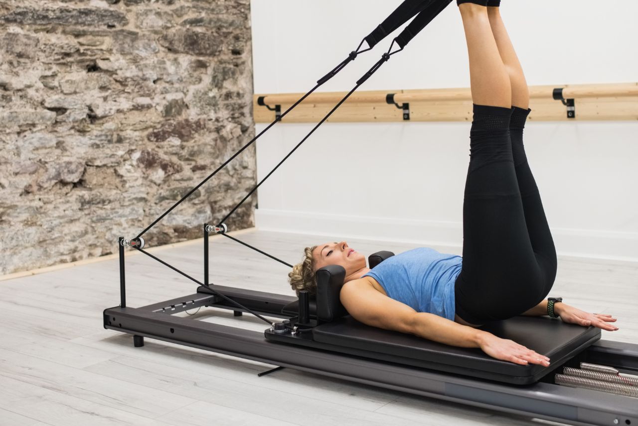 Pilates Machine Using It Pilates Machine Workouts to Improve Flexibility, Posture, and Back ...